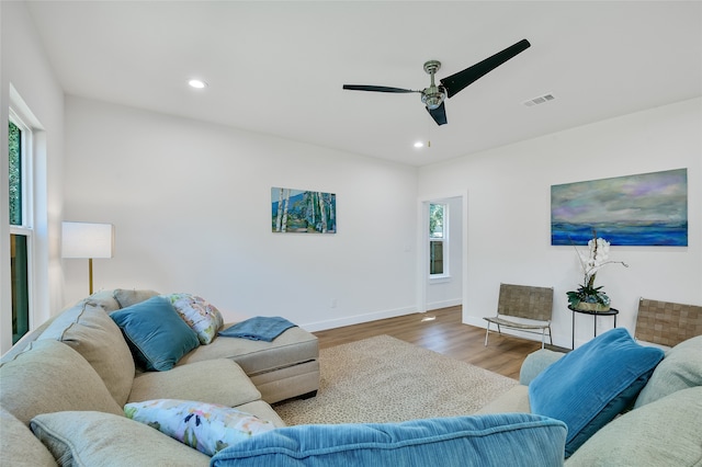 living room with ceiling fan and hardwood / wood-style floors