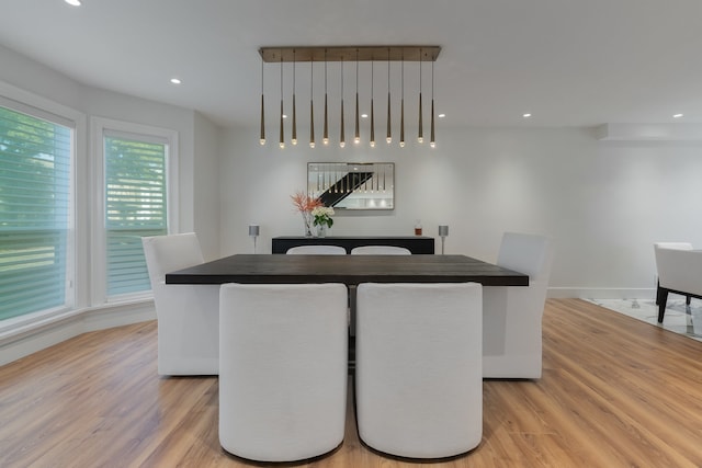 living room featuring light hardwood / wood-style flooring and a high end fireplace