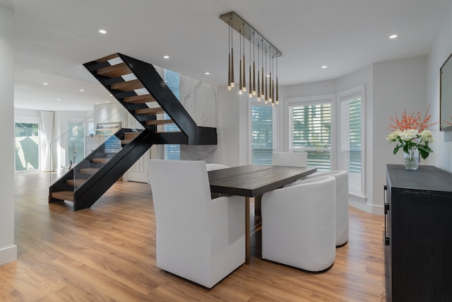 dining space featuring light hardwood / wood-style floors and plenty of natural light