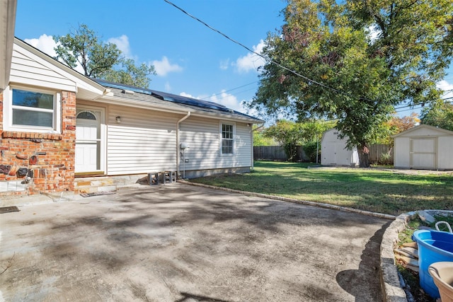 exterior space with a shed