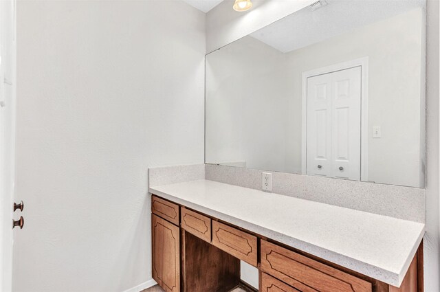 empty room with hardwood / wood-style floors, a textured ceiling, and ceiling fan