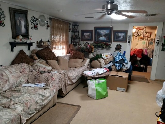 living room with ceiling fan and carpet flooring