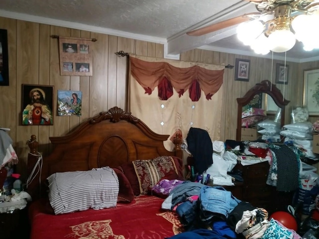 bedroom with crown molding and wood walls