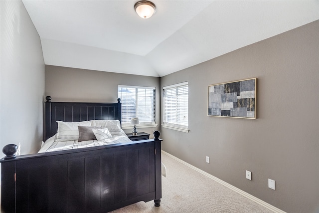 carpeted bedroom featuring vaulted ceiling