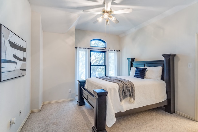 bedroom with ceiling fan and light carpet