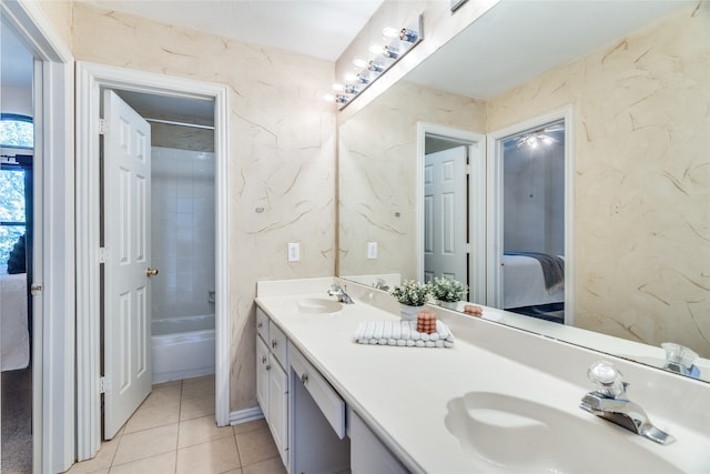 bathroom featuring tile patterned floors, vanity, and tiled shower / bath combo