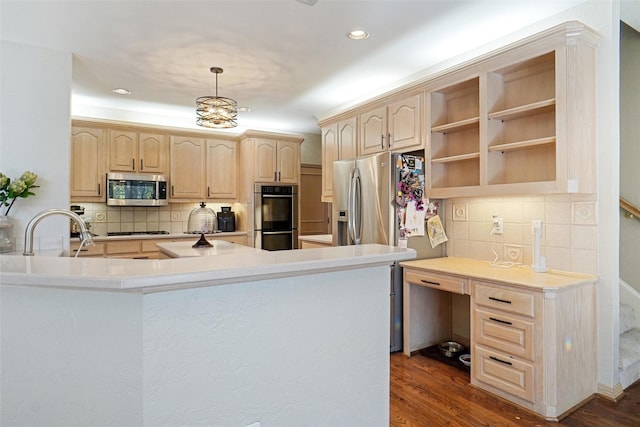 kitchen with dark wood-type flooring, light brown cabinetry, kitchen peninsula, pendant lighting, and stainless steel appliances