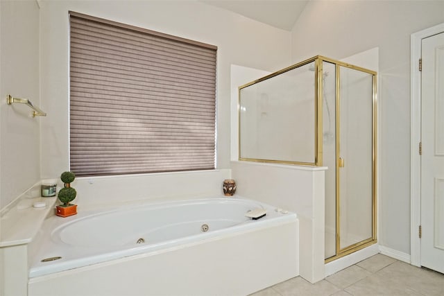 bathroom featuring tile patterned floors and separate shower and tub