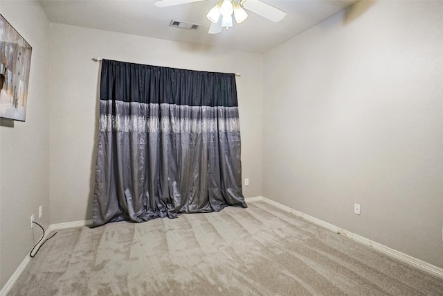 carpeted empty room with ceiling fan