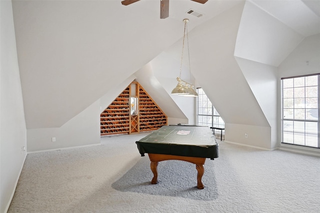 rec room with ceiling fan, vaulted ceiling, and carpet