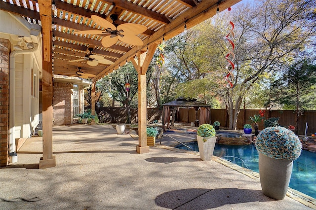 view of patio with a gazebo, ceiling fan, a swimming pool with hot tub, and a pergola