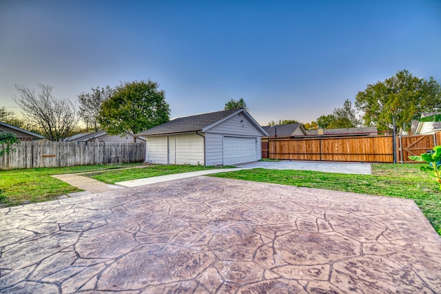 garage featuring a yard