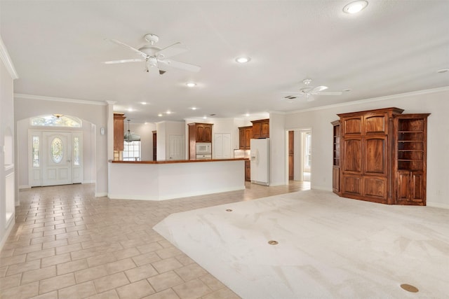 interior space with ceiling fan, light tile patterned floors, and crown molding