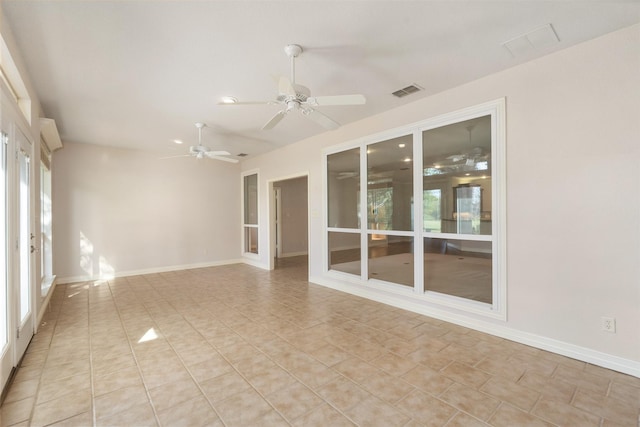 empty room featuring ceiling fan and light tile patterned flooring