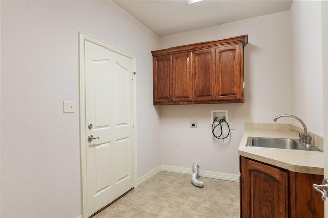 clothes washing area featuring electric dryer hookup, cabinets, sink, and hookup for a washing machine