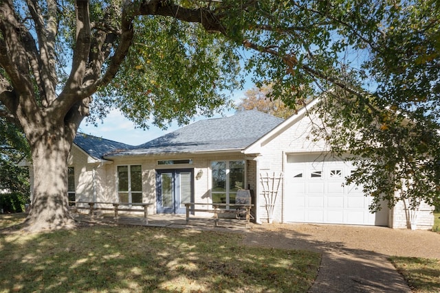 view of front of property with a garage