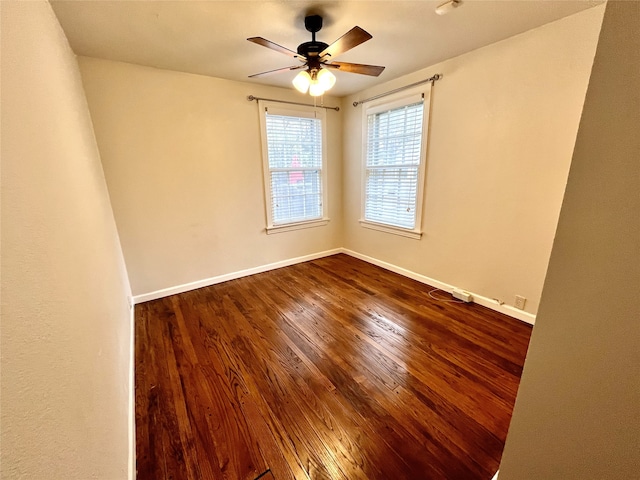 spare room with wood-type flooring and ceiling fan