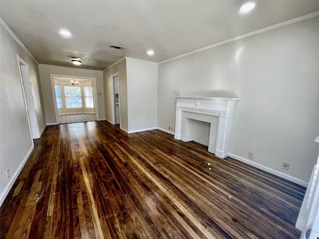 unfurnished living room with crown molding and dark hardwood / wood-style floors