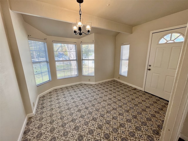 foyer with a chandelier