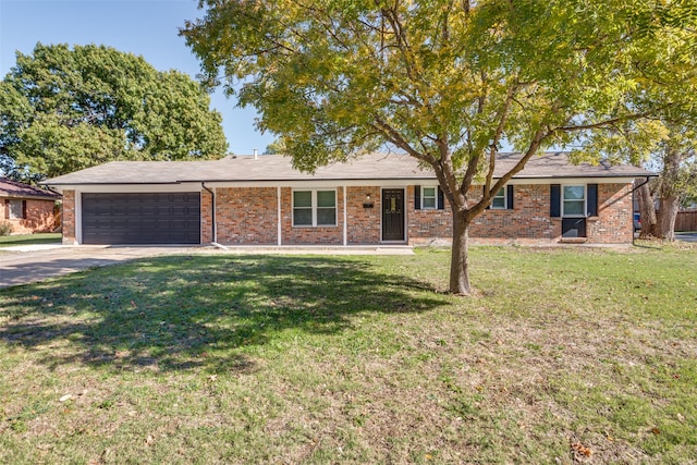 ranch-style house with a garage and a front lawn