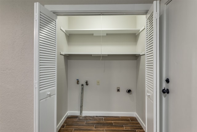 laundry area featuring hookup for an electric dryer and dark wood-type flooring