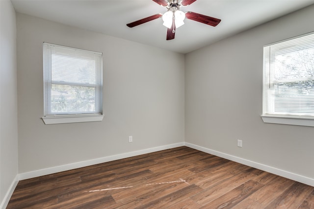 unfurnished room featuring ceiling fan and dark hardwood / wood-style flooring