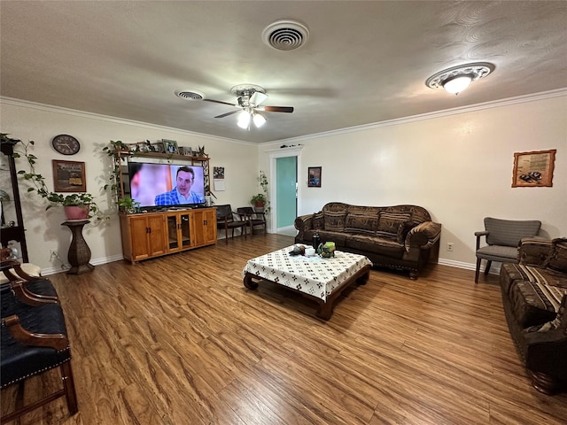 living room featuring ceiling fan, ornamental molding, and hardwood / wood-style floors