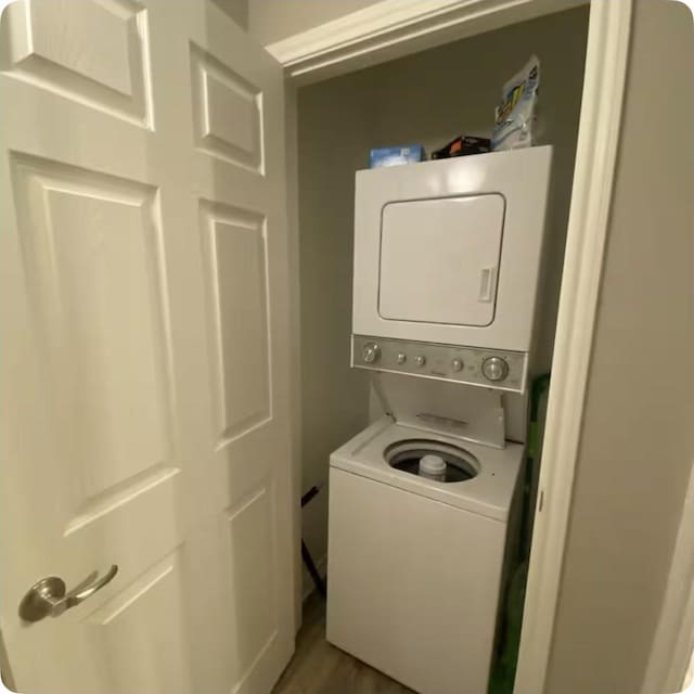 laundry room featuring stacked washer and clothes dryer