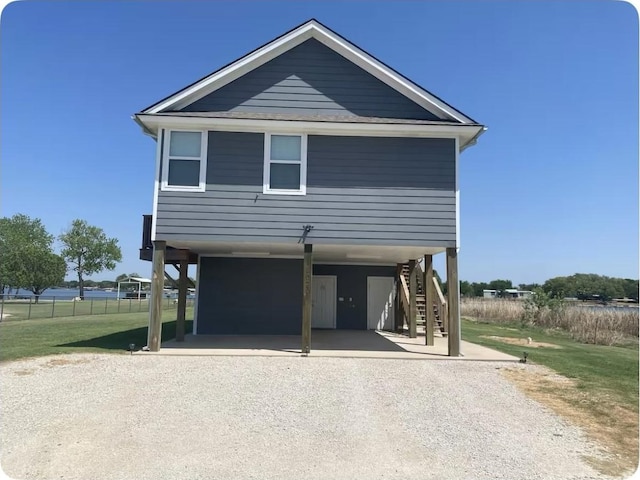 coastal inspired home featuring a carport