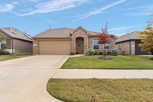 ranch-style house featuring a front lawn and a garage