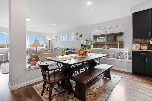 dining space with dark hardwood / wood-style floors