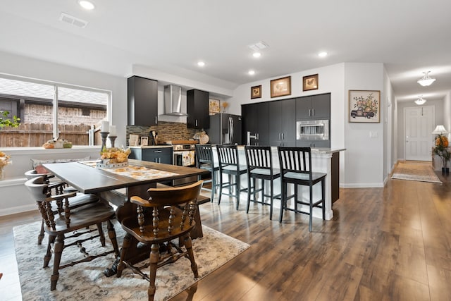 dining area featuring dark hardwood / wood-style floors