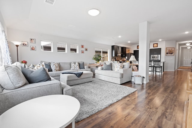 living room featuring dark wood-type flooring