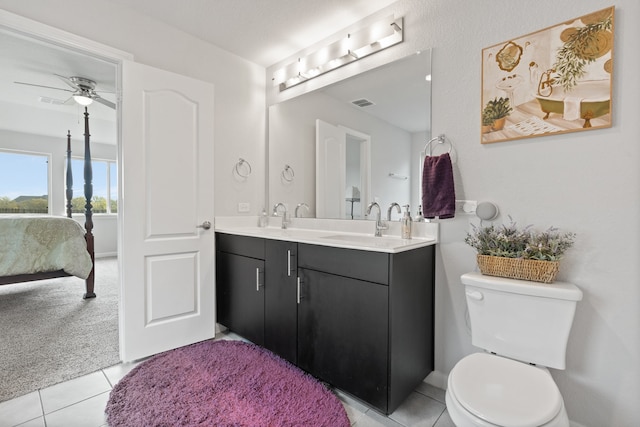 bathroom featuring tile patterned flooring, ceiling fan, toilet, and vanity