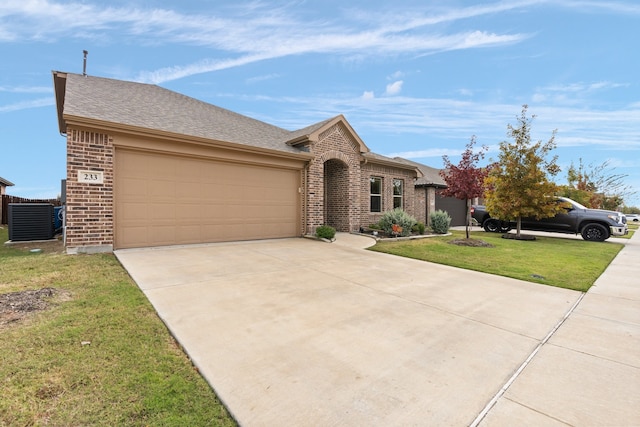 single story home featuring a garage, a front yard, and central AC