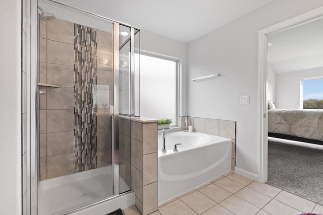 bathroom featuring tile patterned floors, separate shower and tub, and plenty of natural light