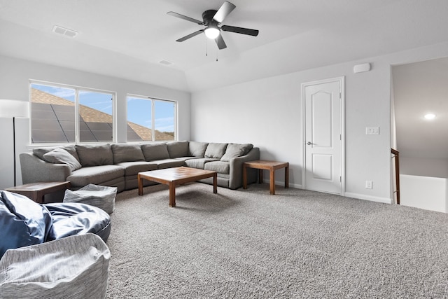 living room with carpet flooring, ceiling fan, and lofted ceiling