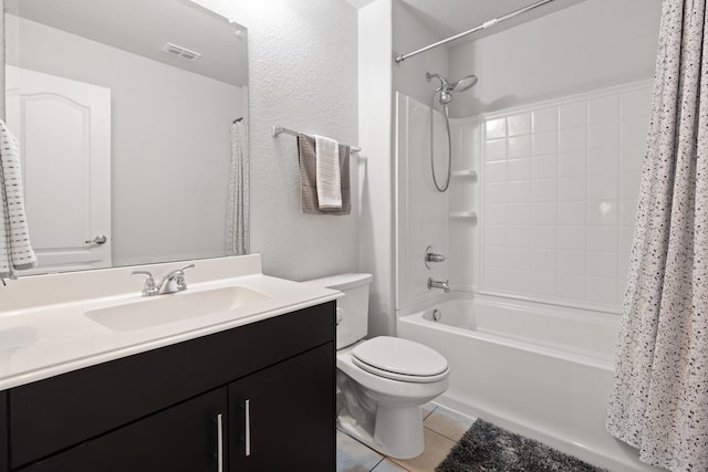 full bathroom featuring tile patterned flooring, vanity, toilet, and shower / bath combo with shower curtain