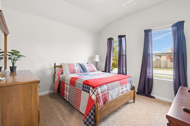 bedroom featuring carpet floors and vaulted ceiling