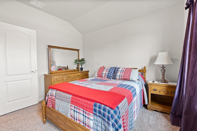 carpeted bedroom with vaulted ceiling