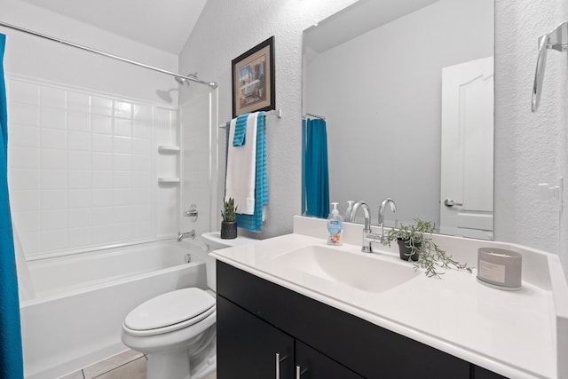 full bathroom with tile patterned flooring, vanity, toilet, and shower / tub combo