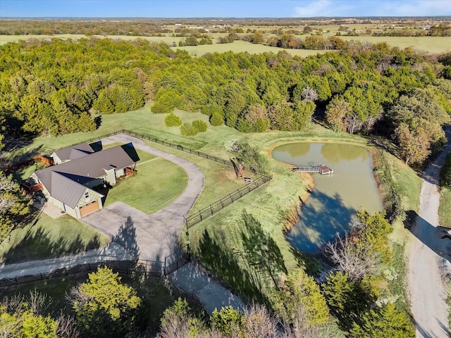 birds eye view of property with a rural view and a water view