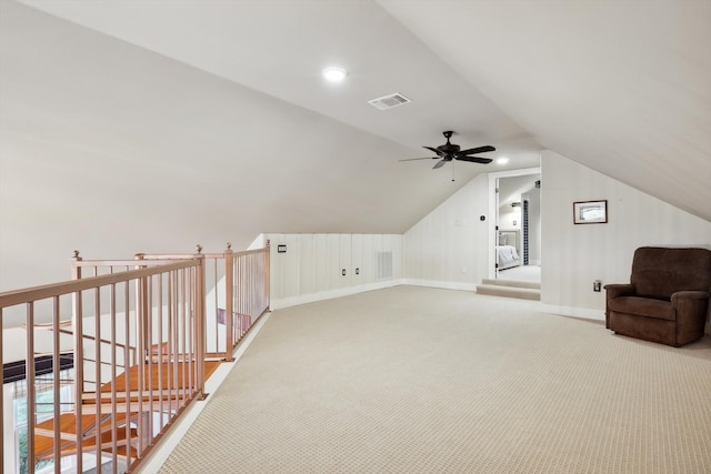 additional living space featuring vaulted ceiling, carpet flooring, and ceiling fan