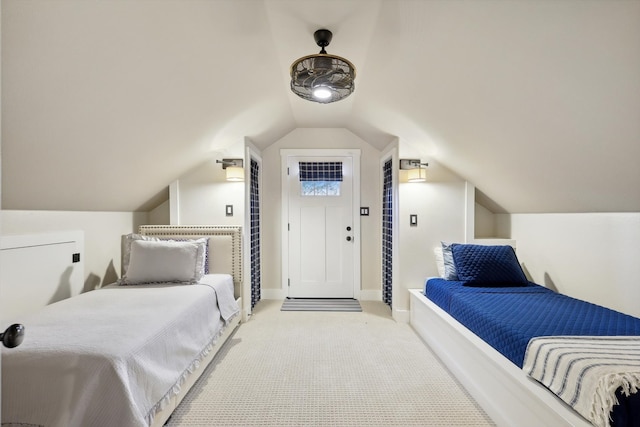 carpeted bedroom featuring lofted ceiling