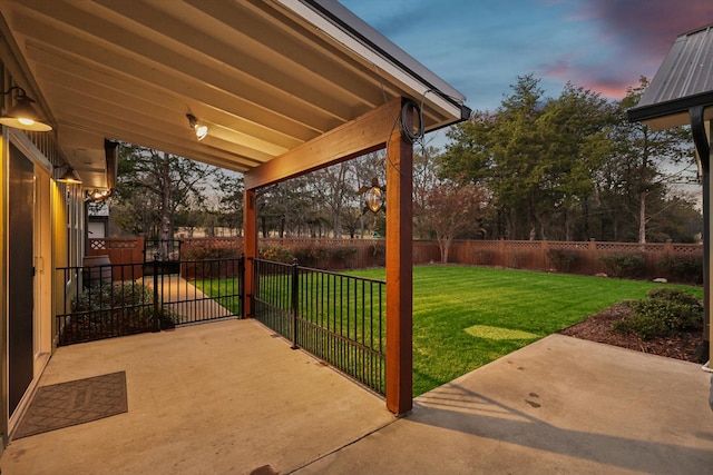 patio terrace at dusk with a lawn