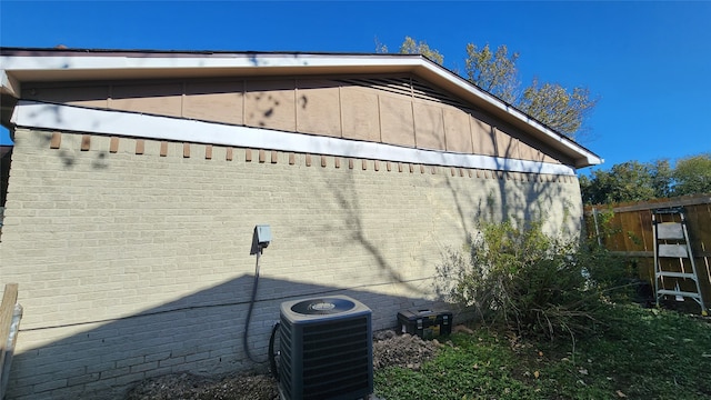 view of home's exterior with central AC unit