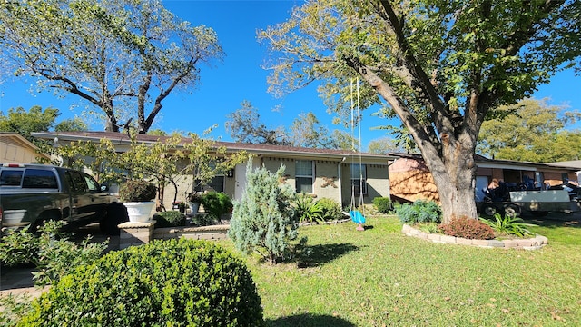 ranch-style home with a front yard