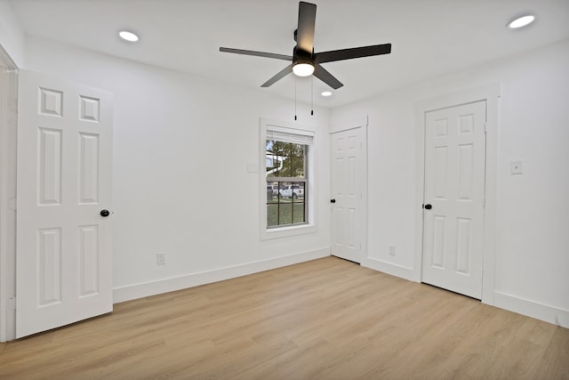 unfurnished bedroom with light hardwood / wood-style flooring and ceiling fan