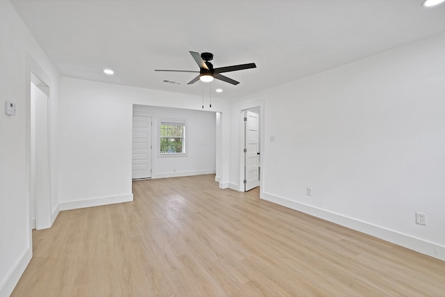 empty room featuring light wood-type flooring and ceiling fan