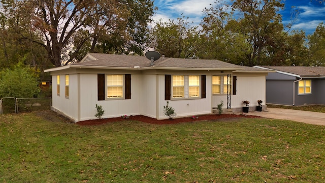 view of front of home with a yard